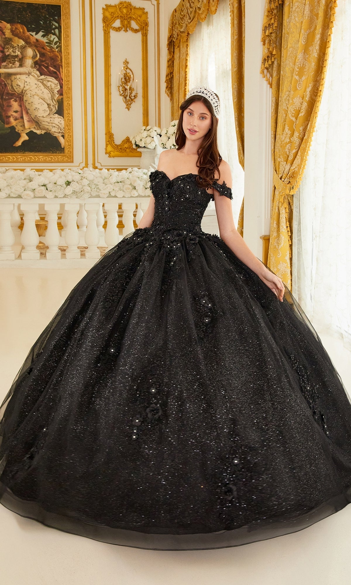 A woman in the Ladivine 15702 Quinceañera Dress with 3-D Flowers and a tiara stands in an ornate room with elegant white and gold decor.